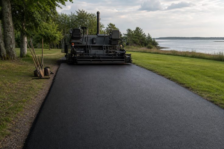 Moncton Paving Co crew grading a driveway base